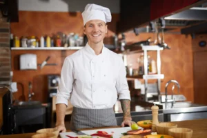Five hospitality staff smiling