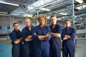 Five hospitality staff smiling